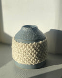 Hand carved scultural vessel thrown by hand by ceramicist Emily Dillon in the West of Ireland, featuring a hand knitted wool sleeve in 100% Irish Wool