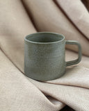 Hand thrown ceramic cup made in Ireland by ceramicist Emily Dillon using stoneware clay
