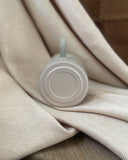 Underside of detail of hand thrown ceramic mug made in Ireland by ceramicist Emily Dillon, showing makers mark