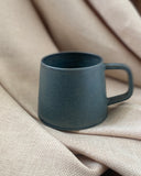 Hand thrown ceramic cup made in Ireland by ceramicist Emily Dillon using stoneware clay