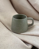 Hand thrown sage green espresso cup with by ceramicist Emily Dillon