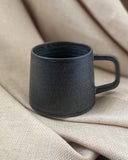 Hand thrown ceramic cup made in Ireland by ceramicist Emily Dillon using stoneware clay