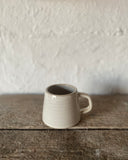 Hand thrown ceramic espresso cup made in Ireland by ceramicist Emily Dillon using stoneware clay