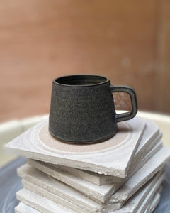 Hand thrown blue espresso cup with by ceramicist Emily Dillon
