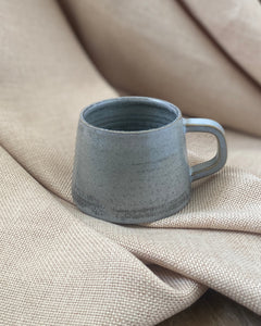 Hand thrown blue espresso cup with by ceramicist Emily Dillon