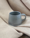 Hand thrown blue espresso cup by ceramicist Emily Dillon