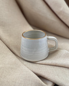 Hand thrown espresso cup with gold lustre by ceramicist Emily Dillon