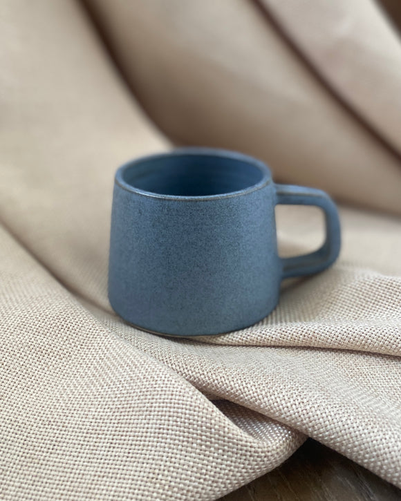 Hand thrown blue espresso cup with by ceramicist Emily Dillon