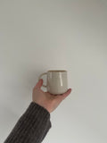 Hand thrown cup with gold lustre by ceramicist Emily Dillon