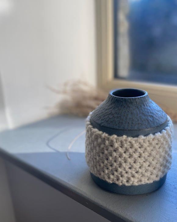 Hand carved scultural vessel thrown by hand by ceramicist Emily Dillon in the West of Ireland, featuring a hand knitted wool sleeve in 100% Irish Wool