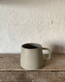 Hand thrown ceramic cup made in Ireland by ceramicist Emily Dillon using stoneware clay